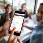 Waitress holding online menu on a smart phone